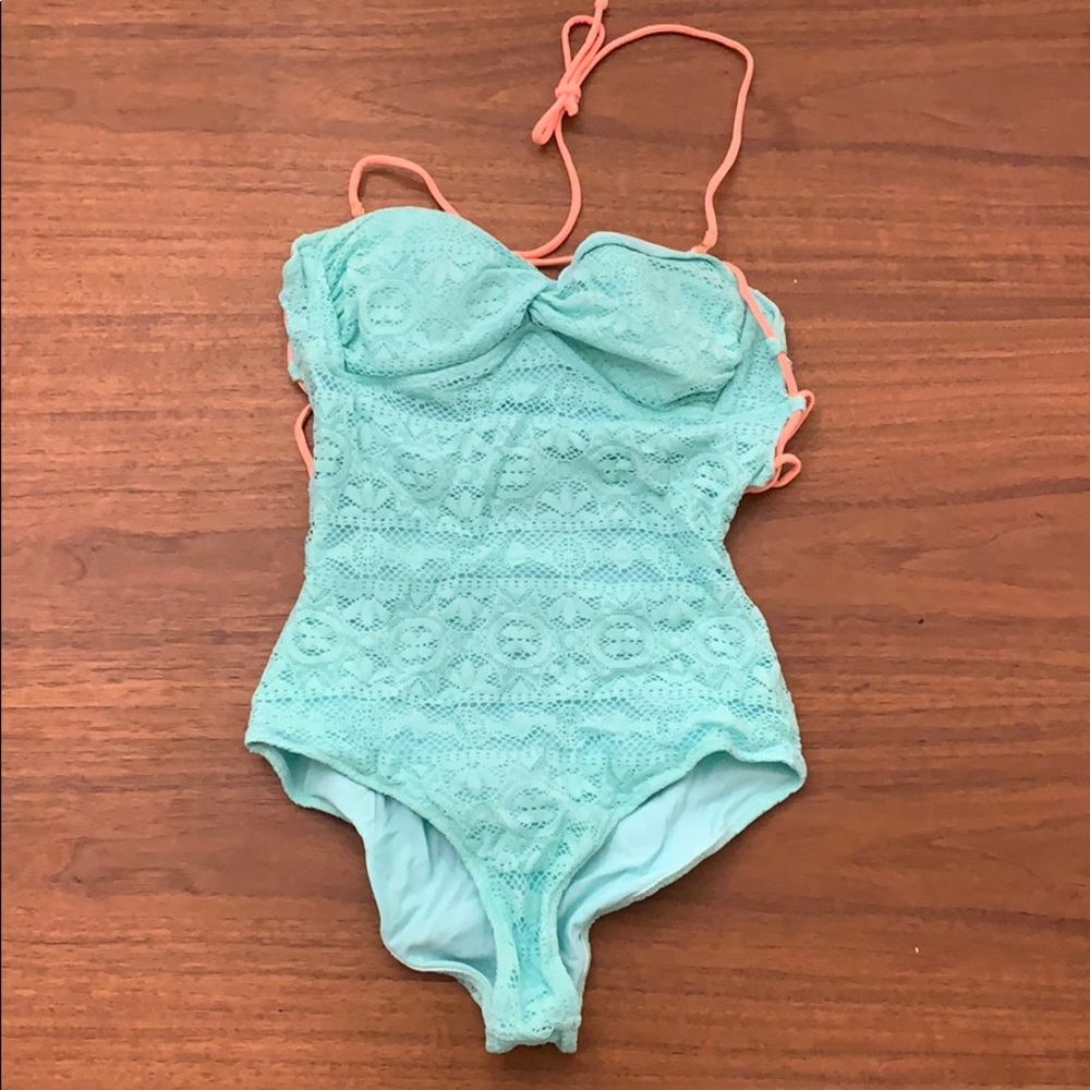 Mint and orange swim suit VS